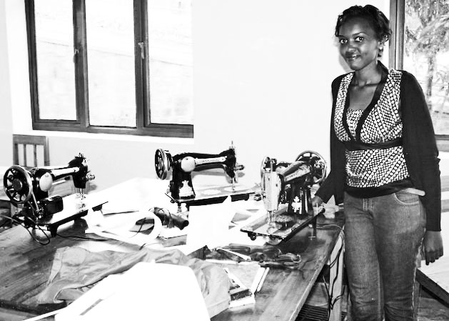 One of the women who learned to sew at Centre César, a community centre in village of Avega in Kimironko, near Kigali, Rwanda's capital. The centre runs free training sessions and classes here include course in mechanics, traditional singing and dancing, and silk screening. Credit: Amy Fallon/IPS